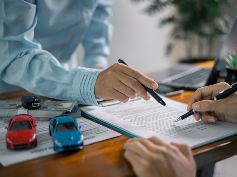 Customer signing paperwork