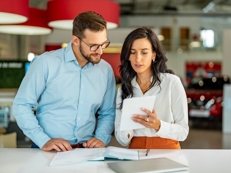 Casa CDJR financial advisor helping out a customer