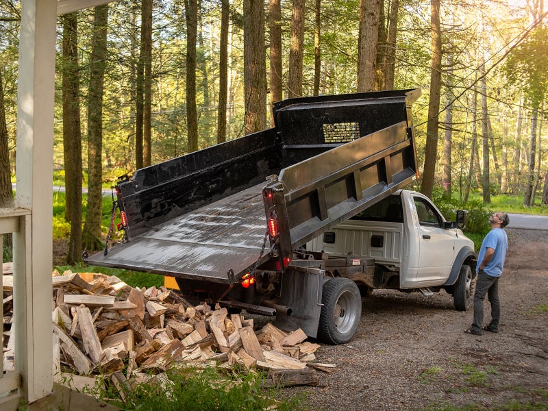 Ram Truck dropping off logs